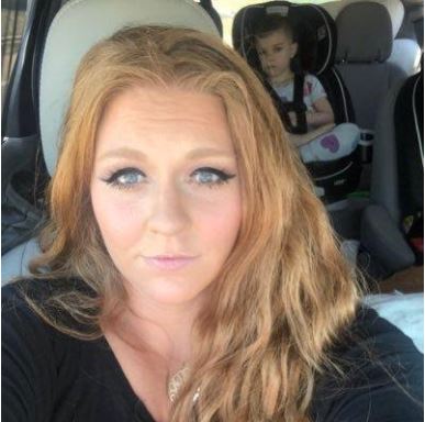Crosby Reid with her son in the back seat of the car